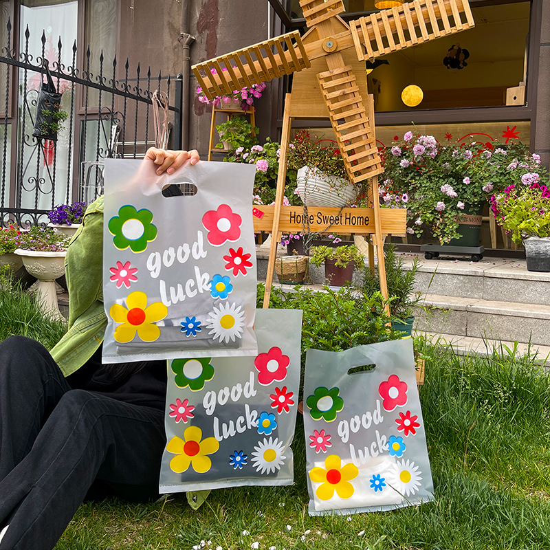 透明 厚手 おしゃれなプラスチックショッピングバッグ / 花柄デザイン 衣装店用 手提げ袋　1点=50枚入り